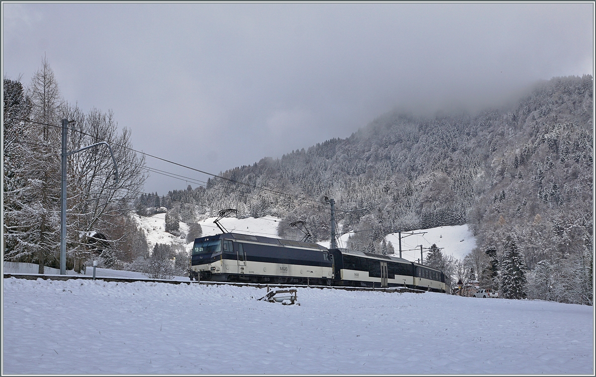 The MOB Ge 4/4 8004 with the MOB local Service from Zweisimmen to Montreux by Les Avants. 02.12.2020