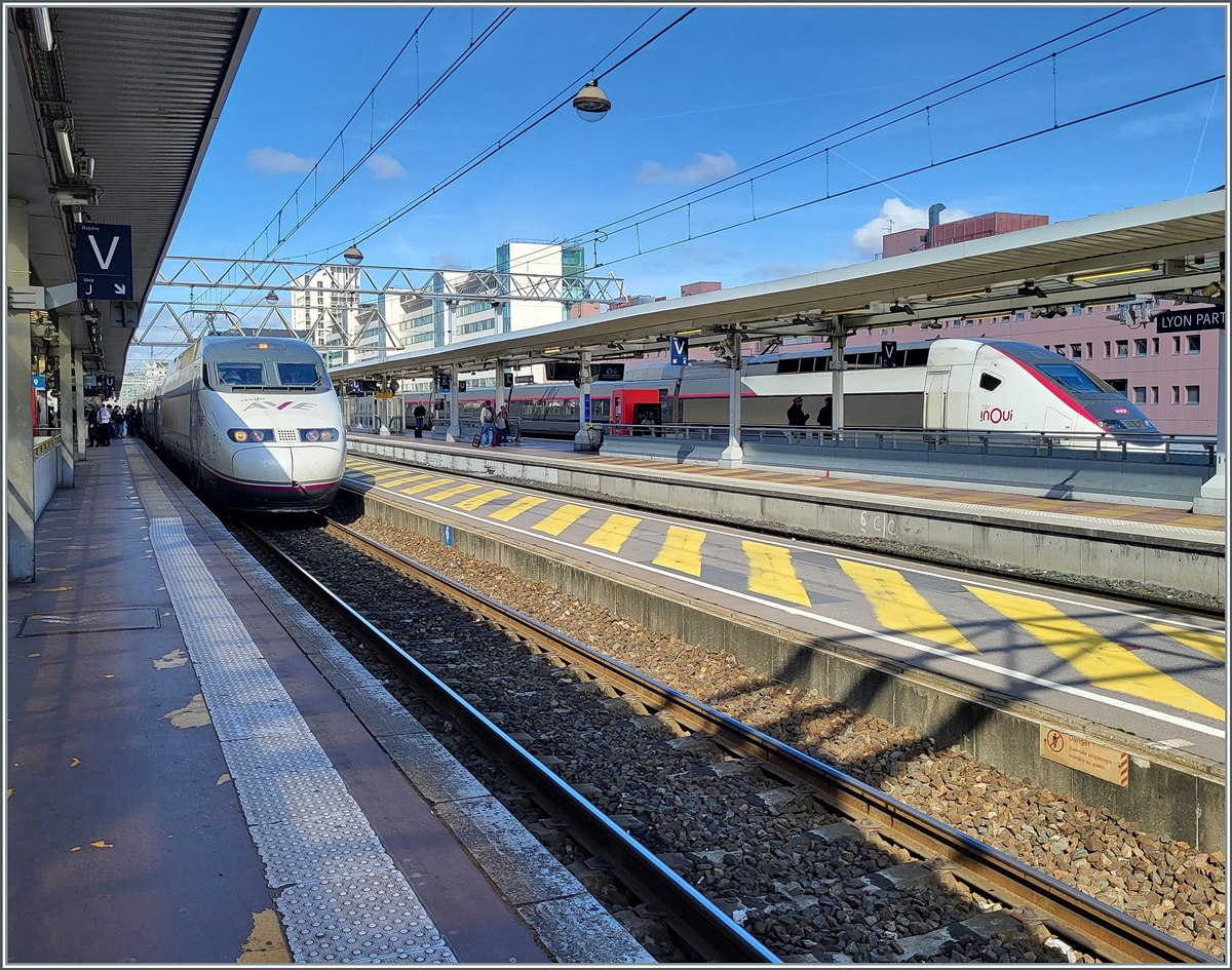 The RENFE AVE 100 221-1 multiple unit waits in Lyon Part Dieu for departure (2:32 p.m.) to Barcelona Sants (at 7:34 p.m.) and in the background a inOui TGV. 

March 13, 2024