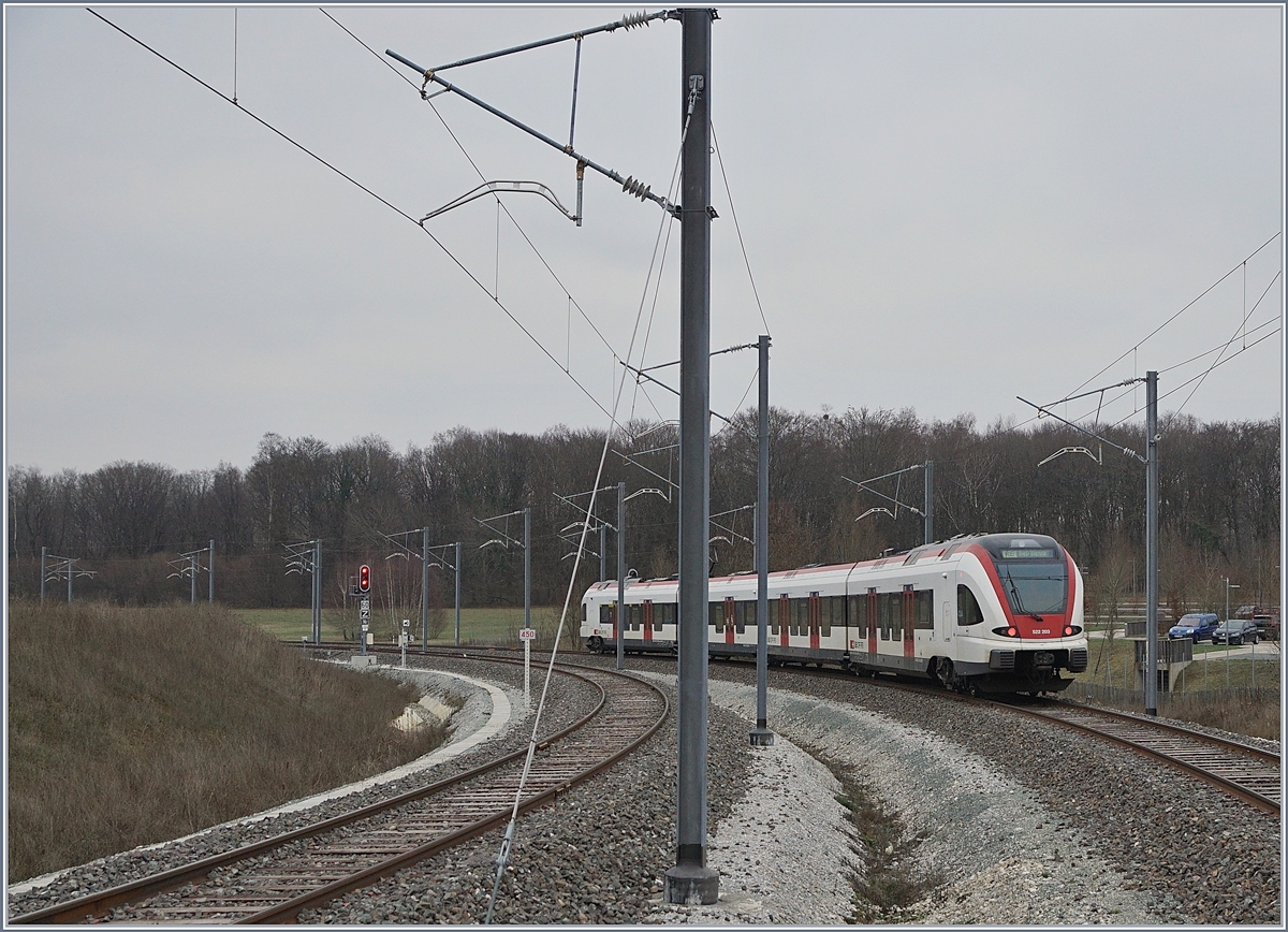 The SBB RABe 522 203 is leaving the new Station Merux TGV on the way to Biel/Bienne.
15.12.2018