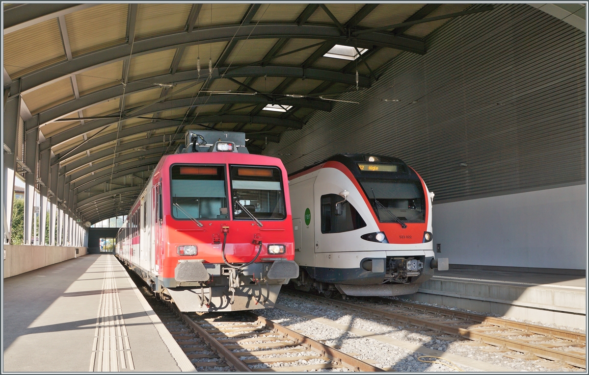 The SBB RBDe 560 384-0 (RBDe 560 DO 94 85 7560 384-0 CH-SBB) to Vallorbe and the RABe 523 022-7 (RABe 523 94 85 0 523 022-7 CH-SBB) on the way to Aigle are waiting in the Le Brassus Station. 15.08.2022