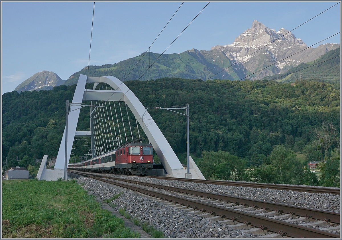 The SBB Re 4/4 11158 with an IR 90 from Sion to Geneva Airport between St Maurice and Bex. 

25.06.2019