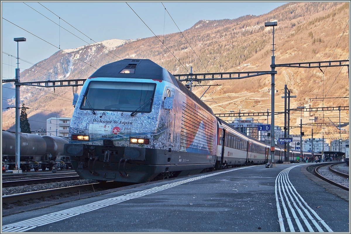 The SBB Re 460 036-7  Welcom to Japan  with an IR in Martigny.

20.02.2015