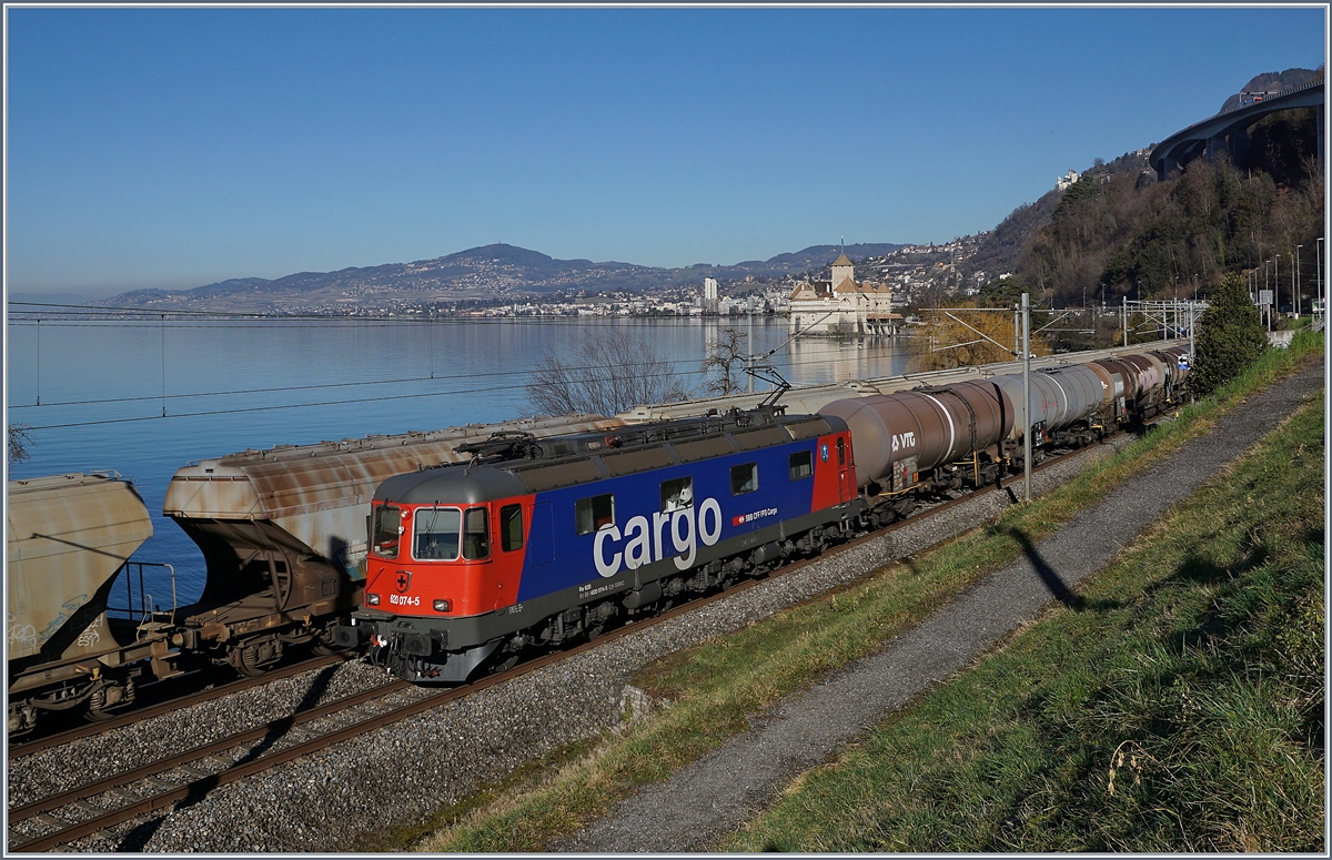 The SBB Re 620 074-5 with a Cargo Train near Villeneuve; in the Background the Castle of Chillon. 

07.02.2020