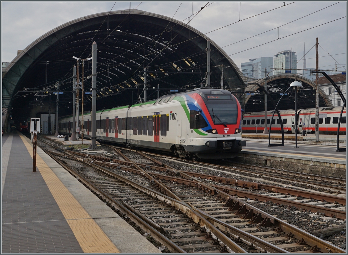 The SBB TILO RABe 523 114 on the way to Locarno is leaving the Milano Centrale Station. 

08.11.2022