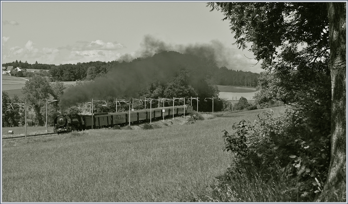 The SNCF 141 R 568 by the L'Association 141R568 by Chénens on the way to Romont.

02.06.2018