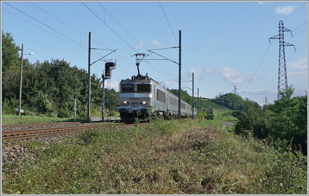 The SNCF BB 22355 with a TER from Geneva to Lyon between La Plaine and Pougny Chancy. 

16.08.2021