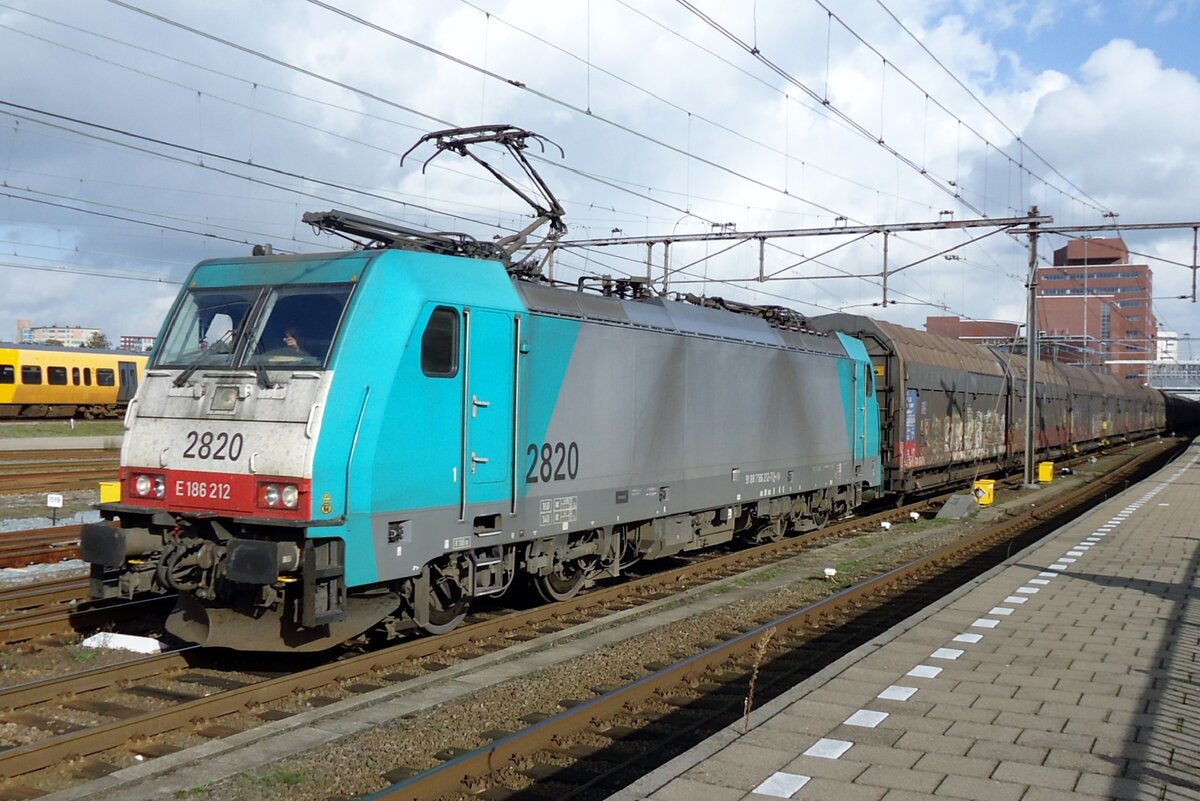 The Sun breaks through at Amersfoort on 17 October 2014 to lighten up 2820 with the Volvo container train to Antwerpen.