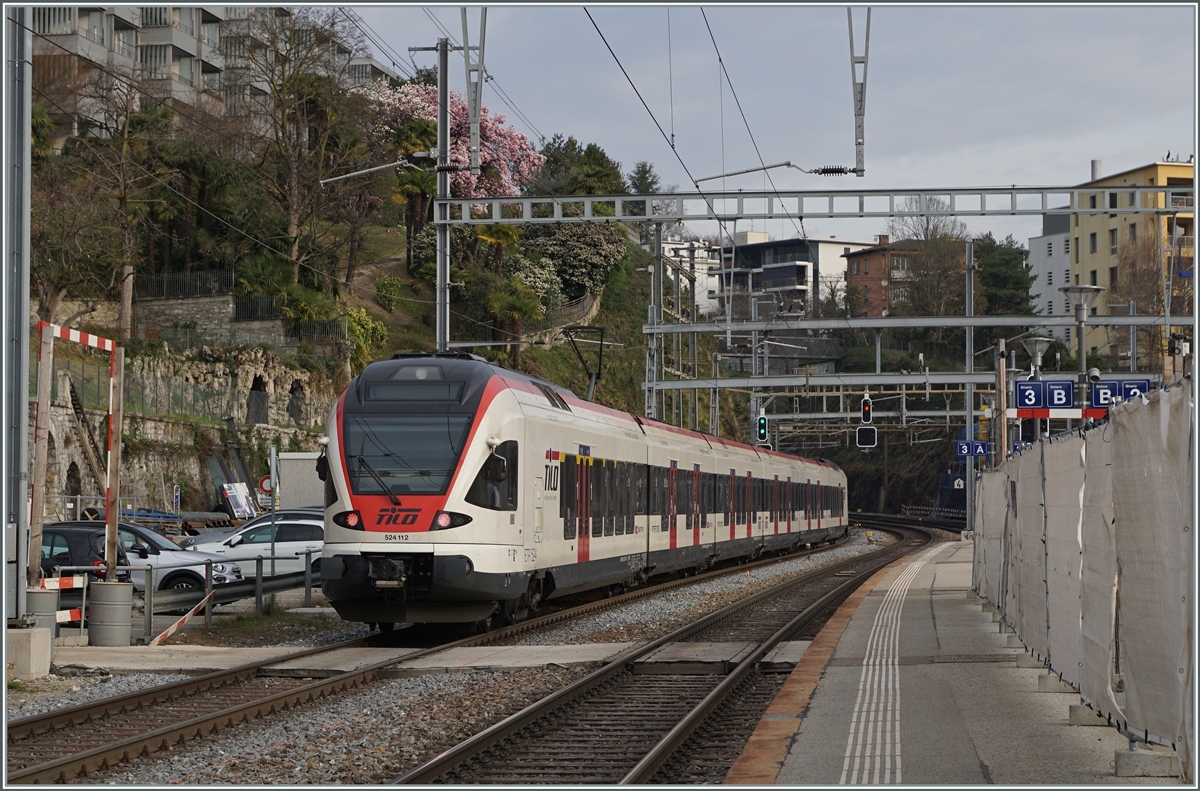 The SWBB RABe 524 112 in the olt Tilo culor is leaving Lugano. 

13.03.2023
