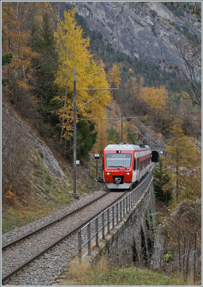 The TMR Region Alps RABe 525 041  NINA  on the way from Sembrancher to Orsières near Sembrancher. 

05.11.2020