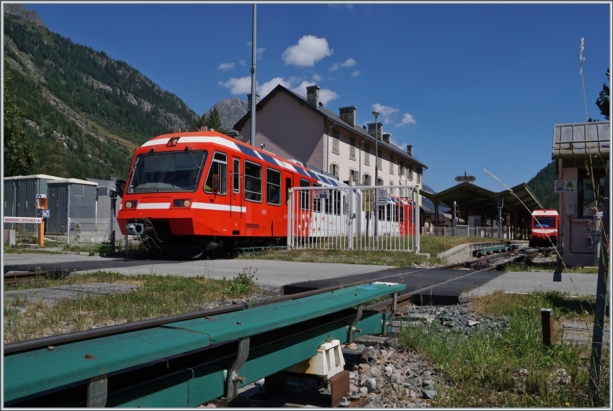 The TMR/SNCF BDeh 4/8 21 is leaving Vallorcine on the way to St-Gervais-les Bains-le-Fayette. In the background the TMR conecting service to Martingny. 

01.08.2022