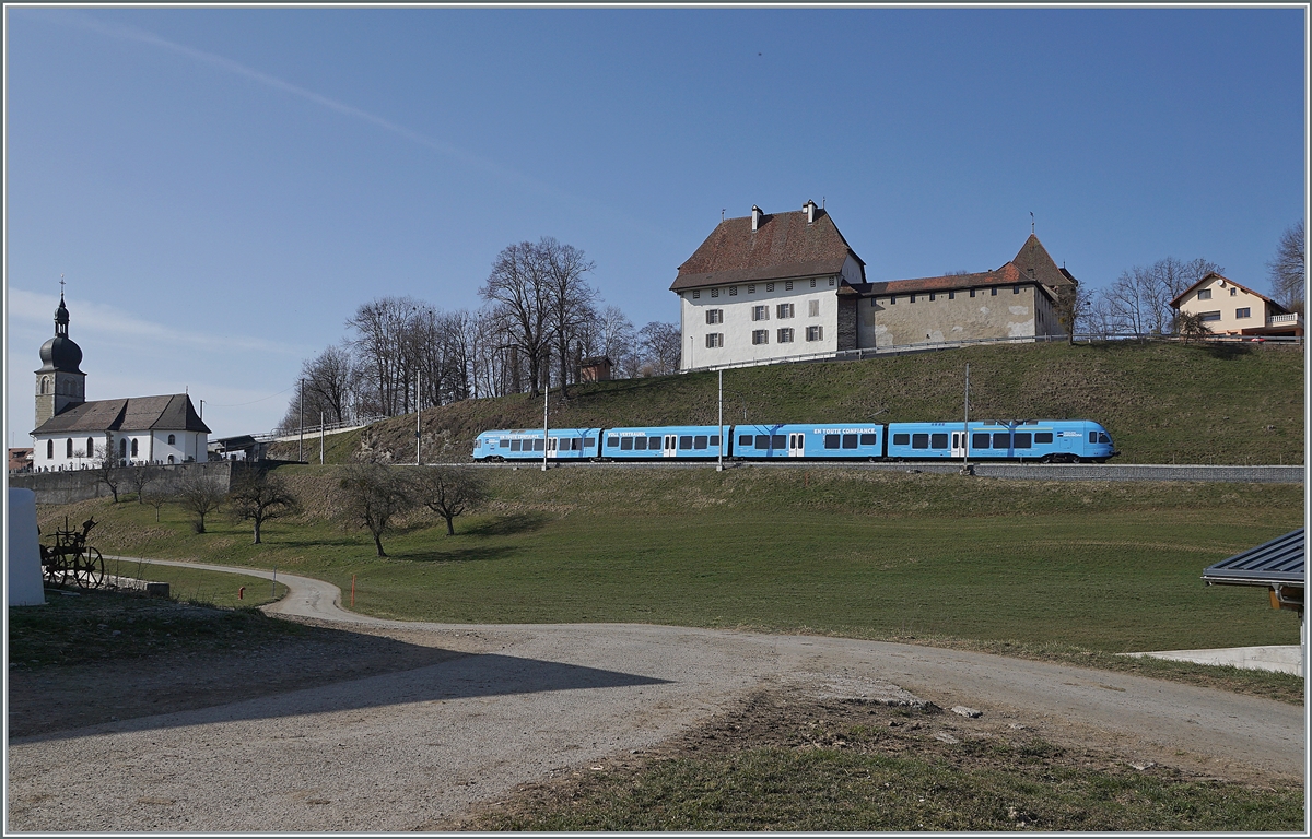 The TPF  Groupe Grisoni  TPF RABe 527 198 on the way to Romont by Vaulruz.

02.03.2021