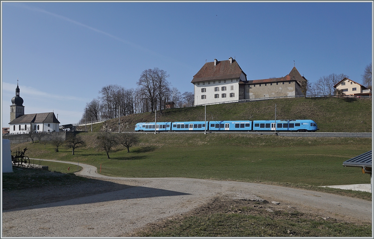 The TPF  Groupe Grisoni  TPF RABe 527 198 on the way to Romont by Vaulruz.

02.03.2021