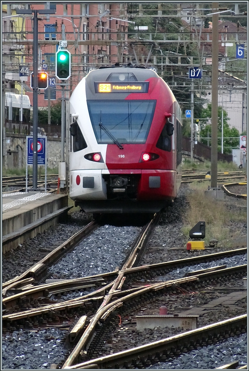 The TPF RABe 527 196 departs Neuchâtel as S21 towards Fribourg. The photo was taken from the platform with plenty of zoom.

August 24, 2026