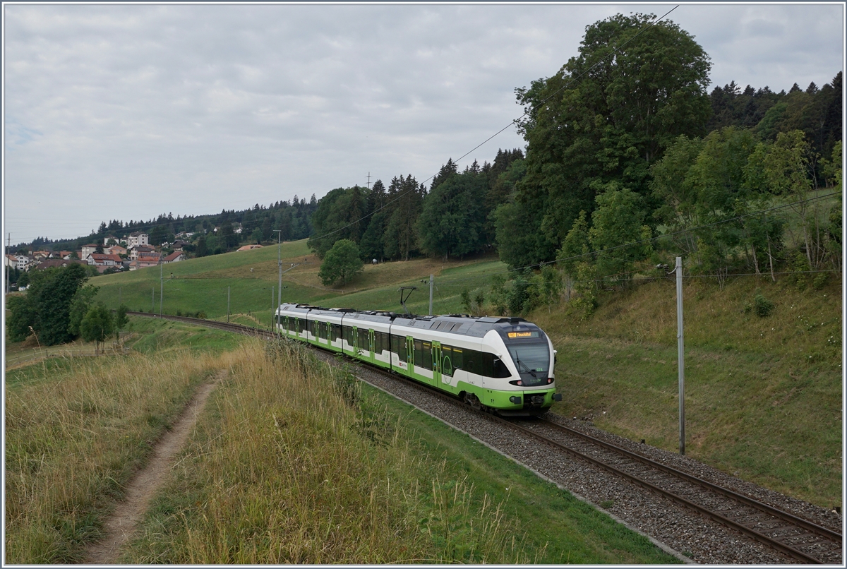 The TransN RABe 523 074 on the way from Le Locle to Neuchatel by Les Haut-Geneveys. 

12.08.2020
