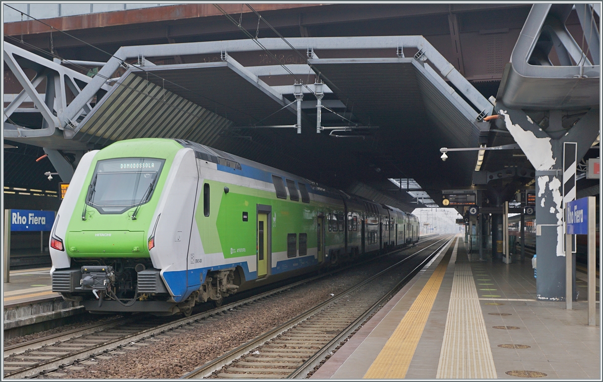 The Trenord ETR 421 030  Rock  to Domodossola by his stop in Rho Fiera Milano. 

24.02.2023