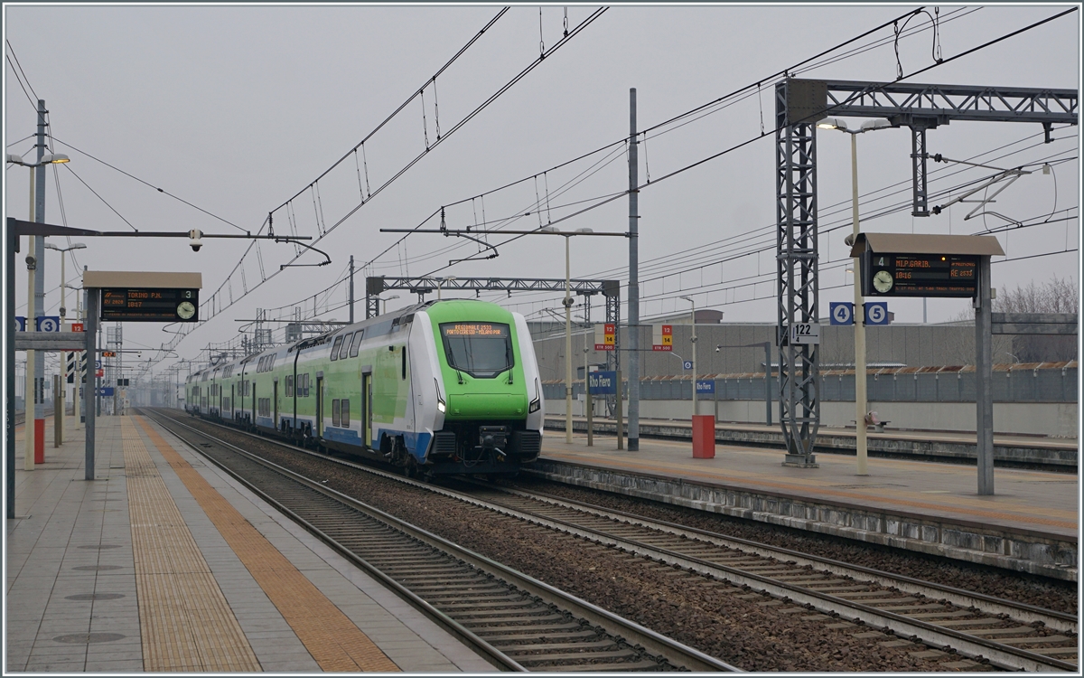 The Trenord ETR 421 031  Rock  from Porto Ceresio to Milano Porta Garibaldi is arriving at the Rho Fiera Milano Station.

24.02.2023