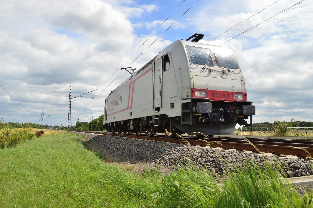 This singleriding class 185 579-0 from the crossrail company called Adriana, is on the way to Aachen West on sunday 6th july 2014. Here it's near Wickrathhahn. 