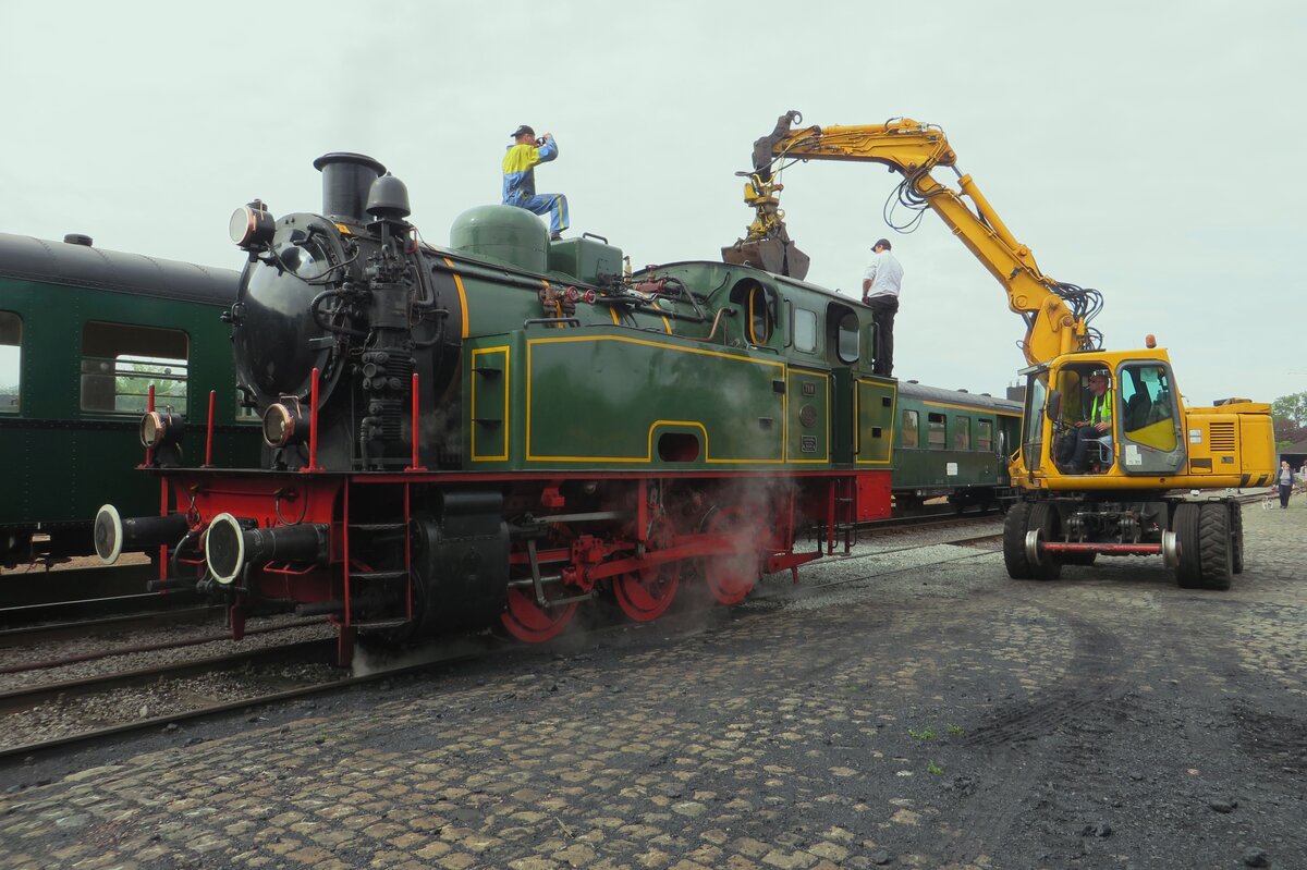 TOM, former Hoogovens Lok 22 gets fresh coal at the SCM in Maldegem on 6 May 2023 during the Steam Weekend. Due to environmental issues and controversies, Tata Steel, owner of two steam engines, decided to quit steam excursions on their areal and sold the two steamers. TOM has found a new asylum in Maldegem.