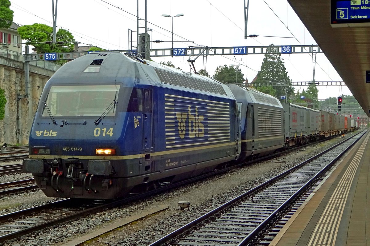 Two: BLS 465 014 has been set in front of 465 015 and the intermodal train at Spiez and gets soaking wet under the rain on 28 May 2019.