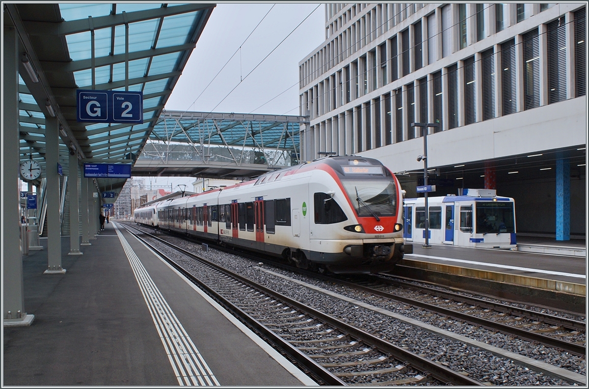 Two SBB RABe Flirt to Vallorbe and Le Brassus leave Renens VD, a TL TSOL Be 4/6 can be seen in the background.

Dec 14, 2023