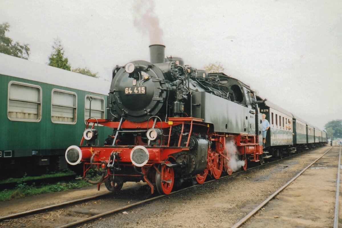 VSM 64 415 stands at Beekbergen with Austrian two-axle coaches on 5 September 2001.