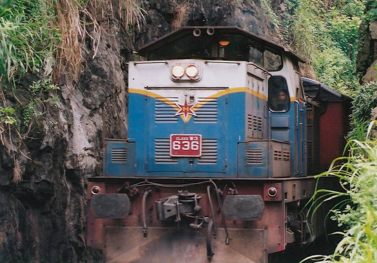 W3 class 636 coming out of a tunnel in the Kadugannawa Pass. 636 is heading to Colombo pulling the afternoon train out of Kandy in Aug 2011.