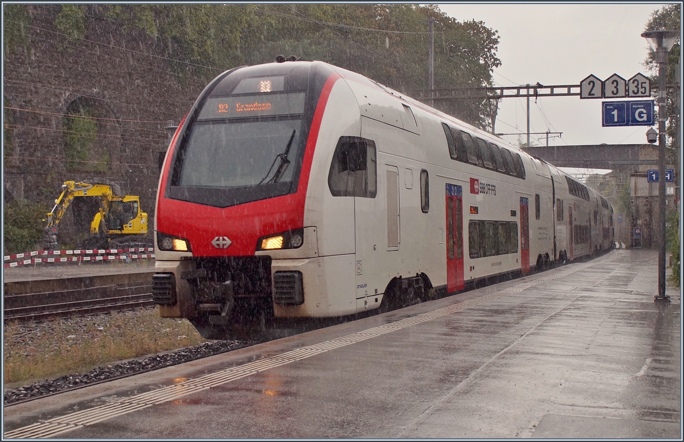 During a heavy rain shower, an SBB RABe 512 as R2 to Grandson arrives at Vevey station.

August 17, 2026