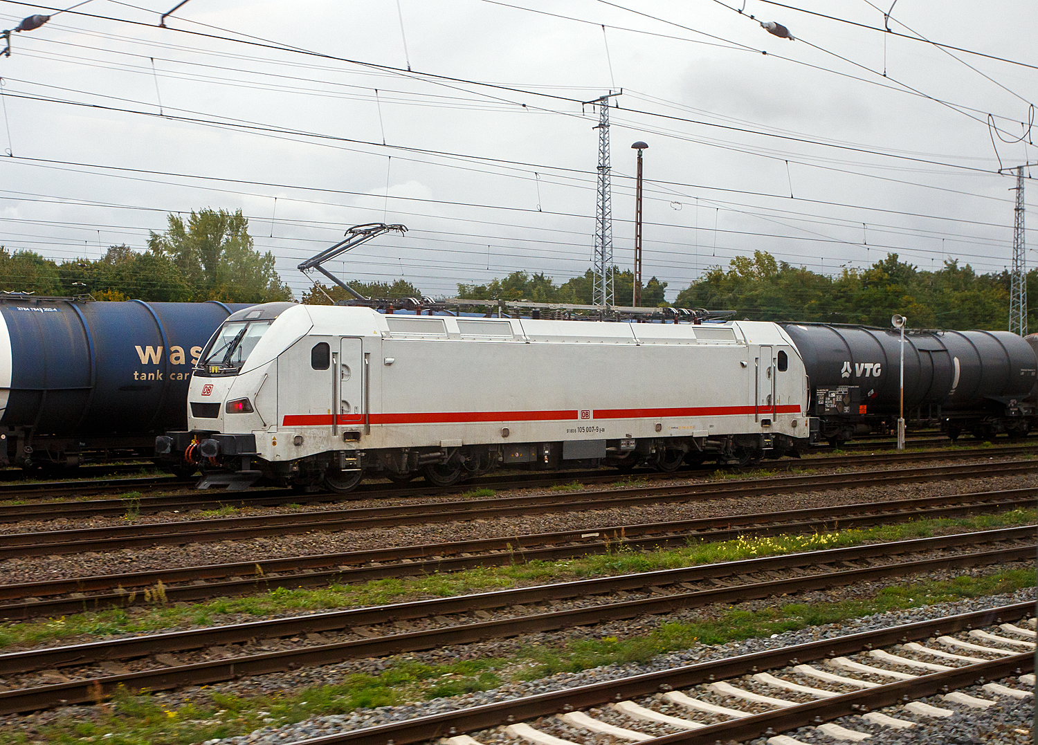 The 105 007-9 (91 80 6105 007-9 D-DB) is a Talgo  Travca  multi-system electric locomotive or TALGO 230 of DB Fernverkehr AG, intended for hauling the ICE L, here on September 24, 2026, at Stendal main station. The locomotive series from the Spanish rail vehicle manufacturer Patentes Talgo, S.L.U. based in Las Matas are designed as multi-system locomotives and are probably still undergoing test and acceptance runs. I was able to take the photo from inside an ICE.

TECHNICAL DATA:
Manufacturer: Patentes Talgo, S.L.U. based in Las Matas (Spain)
Ordered by DB Fernverkehr AG: 60
Track gauge: 1,435 mm (standard gauge)
Axle arrangement: Bo`Bo`
Length (over buffers): 19,700 mm
Height: 4,200 mm
Maximum speed: 230 km/h
Service weight: 88 t
Maximum speed: 230 km/h (200 km/h under 1.5 kV DC)
Continuous power output: 6,400 kW (4,000 kW at 1.5 kV DC)
Starting tractive effort: 300 kN
Number of traction motors: 4
Electrical system: 15 kV, 16.7 Hz AC, 25 kV, 50 Hz AC, as well as 1.5 kV DC
Brakes: electrodynamic rheostatic brake, disc brake
Minimum curve radius: 100 m
Coupling type: screw coupling
Train control: PZB90, LZB, ATB and ETCS Baseline 3
Control system: �BB remote control concept