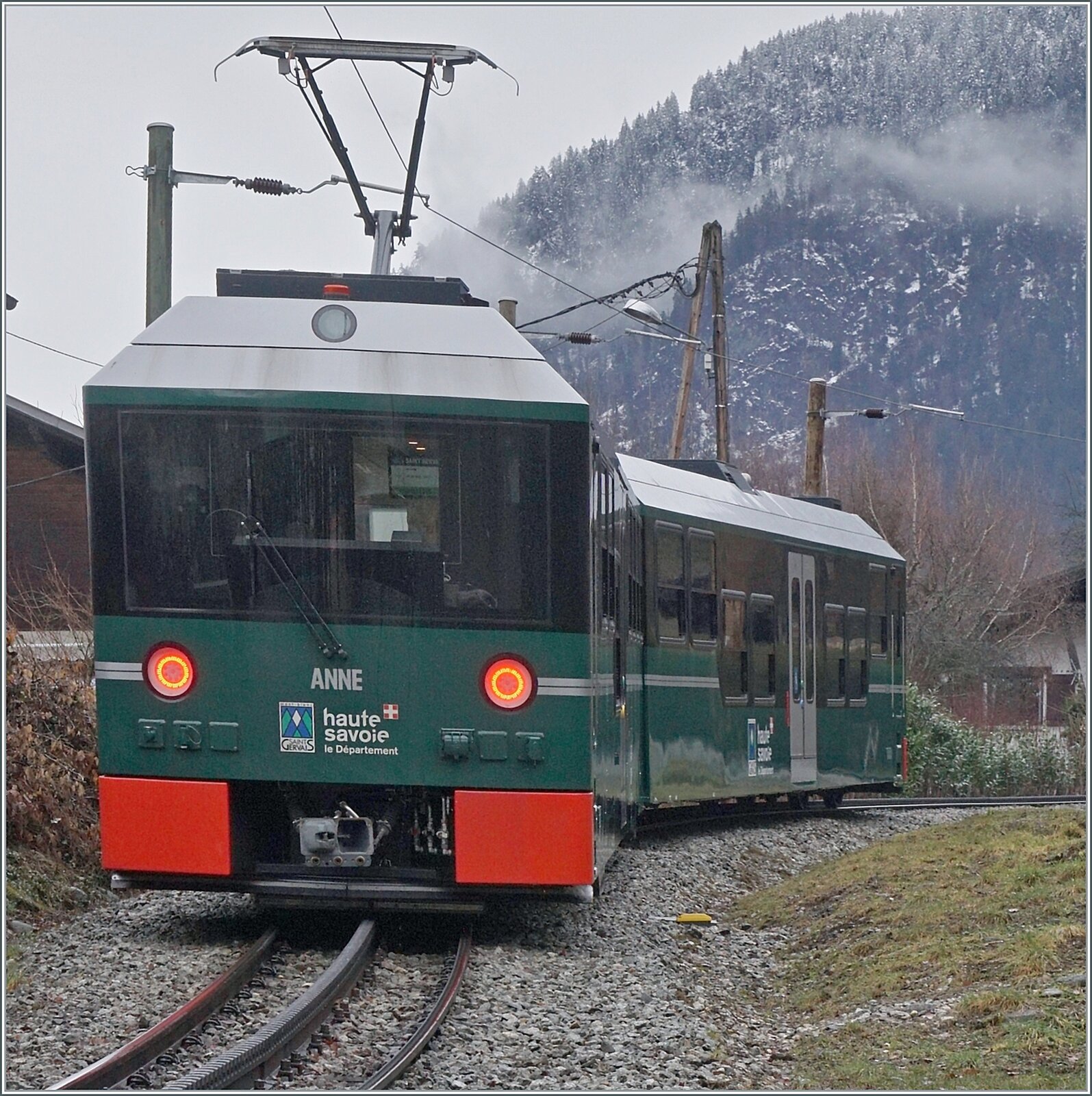 The 12.4 km long TMB (Tramway du Mont-Blanc) rack railway has been running from Saint Gervais les Bains Le Fayet station to the Nid d'Aigle in the Mont Blanc massif since 1913, with the first section to Col de Voza having been opened in the summer of 1908. A curious feature is the ‘naming’ of the vehicles: they have no identification or number but are named after the director's daughters, and each train has its own colour. At the hairpin bend between Le Fayet and St-Gervais, the green ANNE with the control car of the same name is on its way to Col de Voza; the rest of the route is currently closed due to avalanche danger. 

21 February 2026


