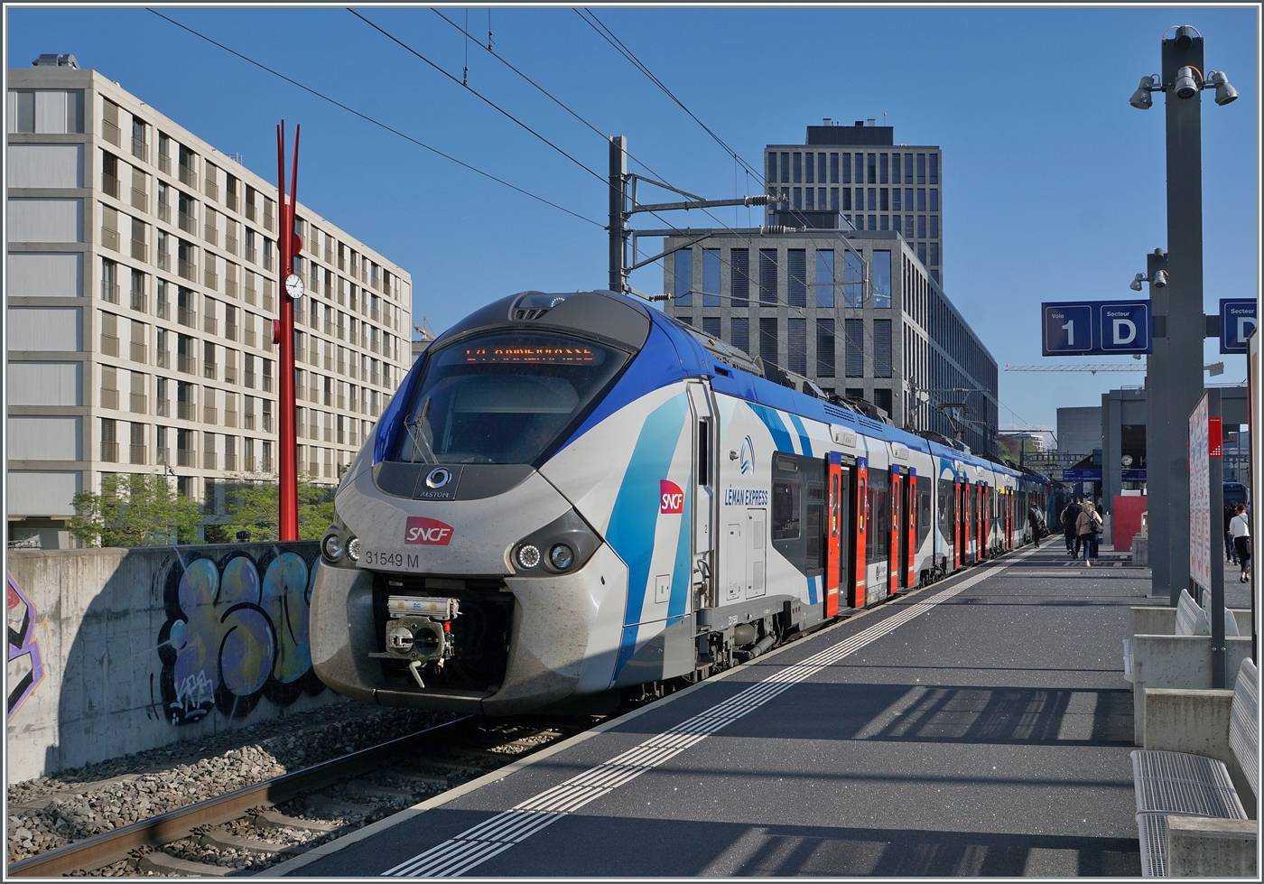 The Coradia Polyvalent regional tri-current 31549M is operating as L�man Express RL4 from Coppet to Annemasse and is captured during the stop at Lancy Pont Rouge.

April 16, 2026