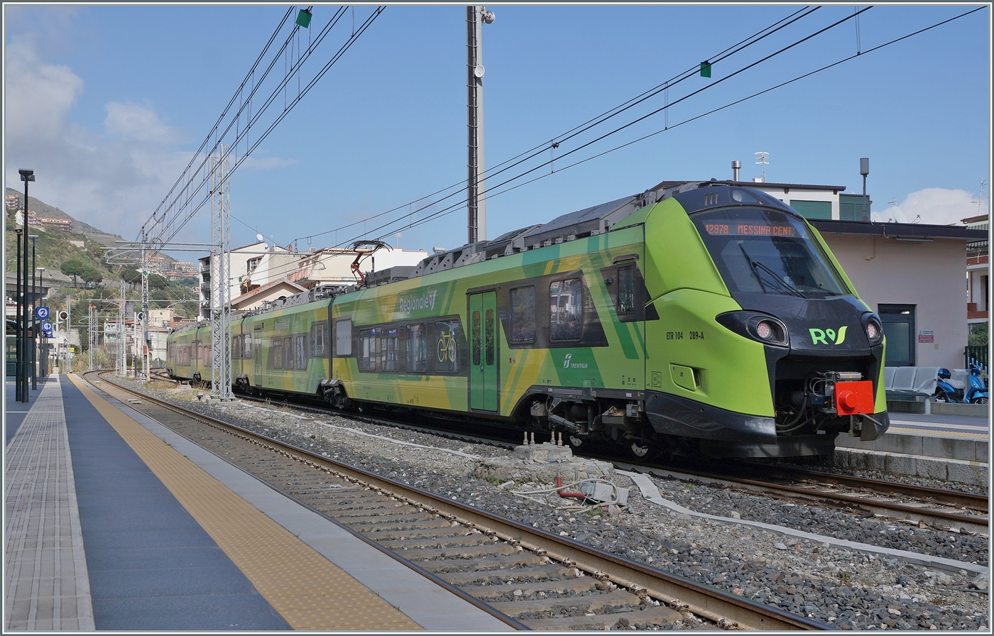 The FS Trenitalia Coradia Stream Pop ETR 104 278 is operating as Regional Train 12978 from Catania to Messina and is arriving at Letojanni, where the crossing with an opposing train must be signaled. The multiple unit is shown in the new FS Trenitalia regional train livery.

March 11, 2026