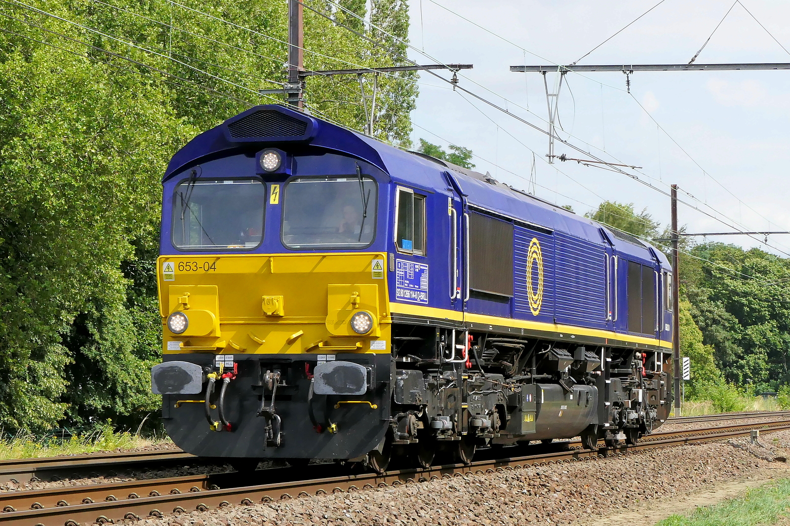 The HSL Belgium 653-04 (266 114) on route to the port of Antwerp. EMD JT42CWR (class 66) build in 2006 with construction N�20048653-004. Line 27A at Antwerp Airport. 23-07-2026