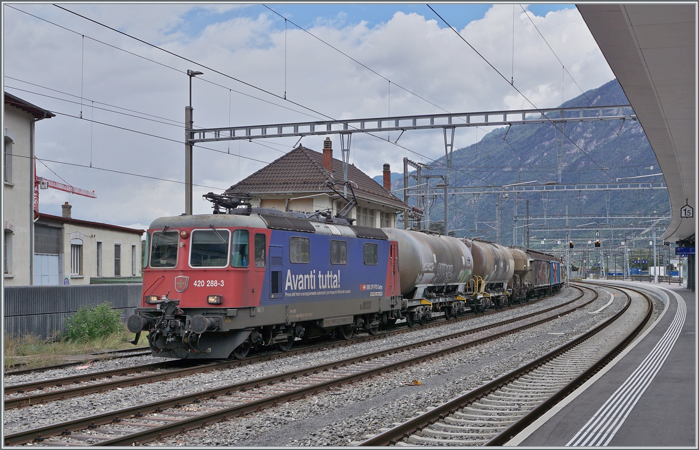 The SBB Re 4/4 II 11288 (Re 420 288-3)  AVANTI TUTTA!  is waiting in Martigny with its local freight train for departure.

September 12, 2024