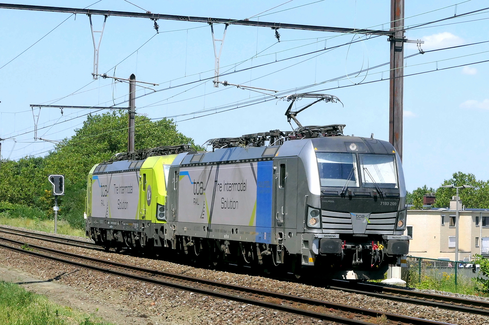 The TCA 7193 209 pulling the TCA 7193 116 from the port of Antwerp back to the TCA container terminal in Athus near the French and Luxembourg border. Siemens Vectron MS build in 2025 with construction N� 23978. Line 27A at Antwerp Airport. 15-07-2026