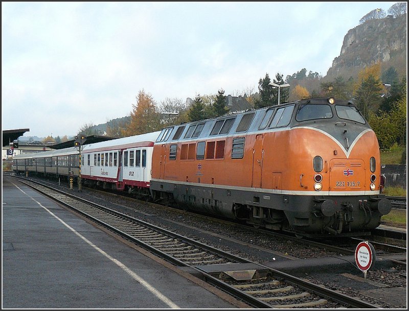 221 135-7 belonging to the Bocholter Eisenbahngesellschaft mbH (BEG) is waiting with its special train composed of historical wagons out of Luxembourg at the station of Gerolstein on November 8th, 2008.