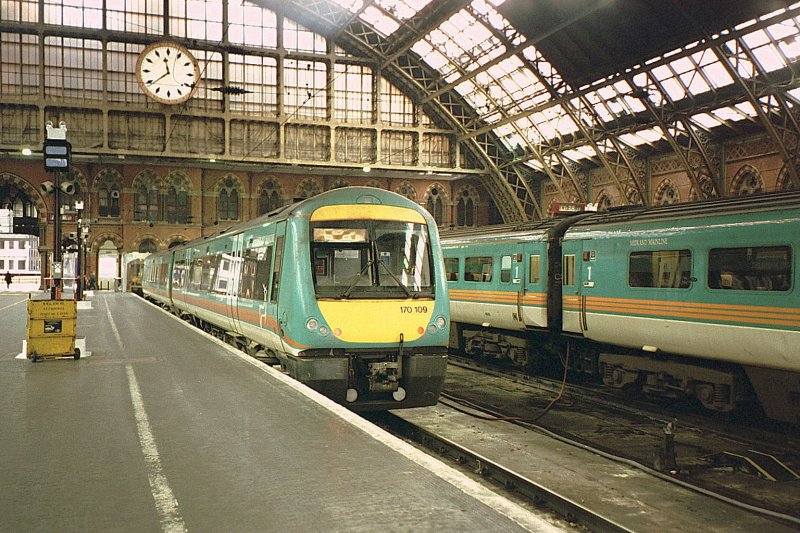 An old time picture form The St Pancras Station on the 9th November 2000. A Midland Mainline 170 109 waits on the platform. 
Today start from here Eurostar services to Paris and Brussels!
(scanned analog picture) 