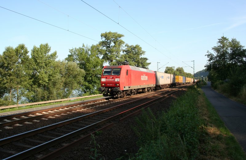 DB 145 039-4 with freight train on the right side of the Rhein river on 16.7.2009 near Leubsdorf. I don´t know why  Probefahrt Werk Dessau  at the window stands.
