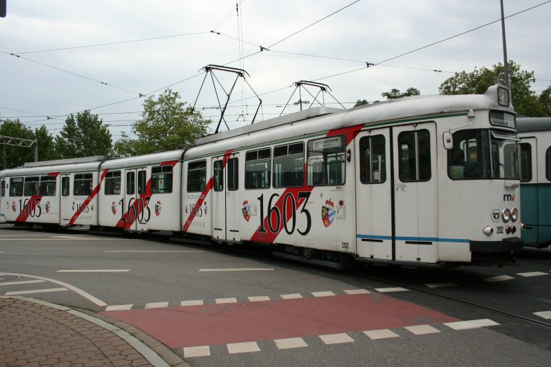 Line 21 with Streetcar GT8 202  Schloquell-Braurei  on 13.07.2009 in front of Heidelberg main station. 