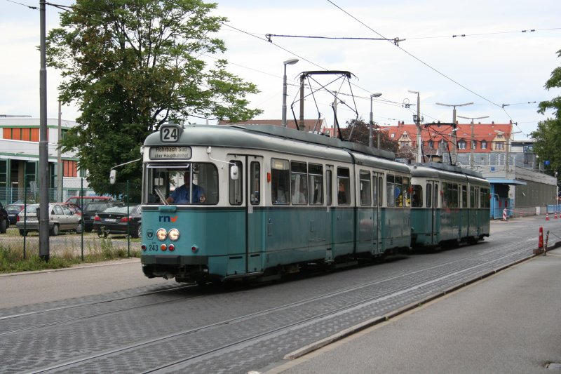 Line 24 with Streetcar GT6+GT6 243+230 on 13.07.2009 in front of Heidelberg main station. 
