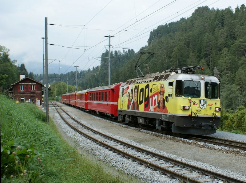 The  Little Red  in yellow: Ge 4/4 II with the RE Disentis - Chur - Scuol is leaving in Valendas-Sagogn.
