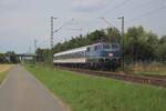 TRI 111 054 in a quasi retro colour scheme pushes RB 37 through Kaarst toward Krefeld on 8 August 2025.