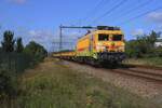 On 5 August 2025 Strukton 1824 hauls a rake of empties through Alverna.