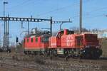 SBB Infra 843 042 gets hauled by an Re 4/4II through Pratteln on 13 February 2024.