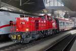 Diesel locomotive 2070 080 pulls several passenger cars through Vienna's main train station. May 03, 2026