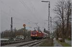 The ÖBB 1016 043 is arriving by a bad weather in Lindau.