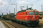 ÖBB 1044 093 hauls a mixed freight into Austria through Passau on 2 June 2003.