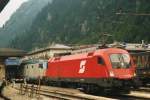 BB 1116 029 has pushed an Italian electric loco in front of an EC to Milano on 2 JUne 2003 at Brennero.