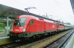 Sadly in the pouring rain: BB 1116 053 with BBEC and dead 1142 in tow at Wien Meidling on 22 May 2008.