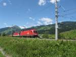 OBB 1116 261 and an uknown 1144 with a works train near Kirchberg in Tirol, August 2012.