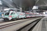 Advertiser 1116 130 stands with a Salzburg-bound IC in Wien Hbf on 5 May 2016.